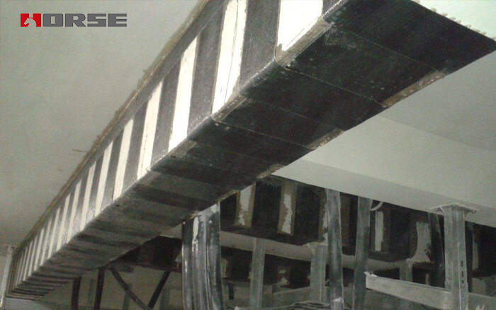 beam retrofitting dengan bahan polimer yang dibekukan ulang serat (FRP)