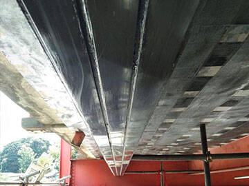 Memperbaiki & Memperkuat Girder Jembatan RC yang Rusak Menggunakan Strip CFRP Serat Karbon HM